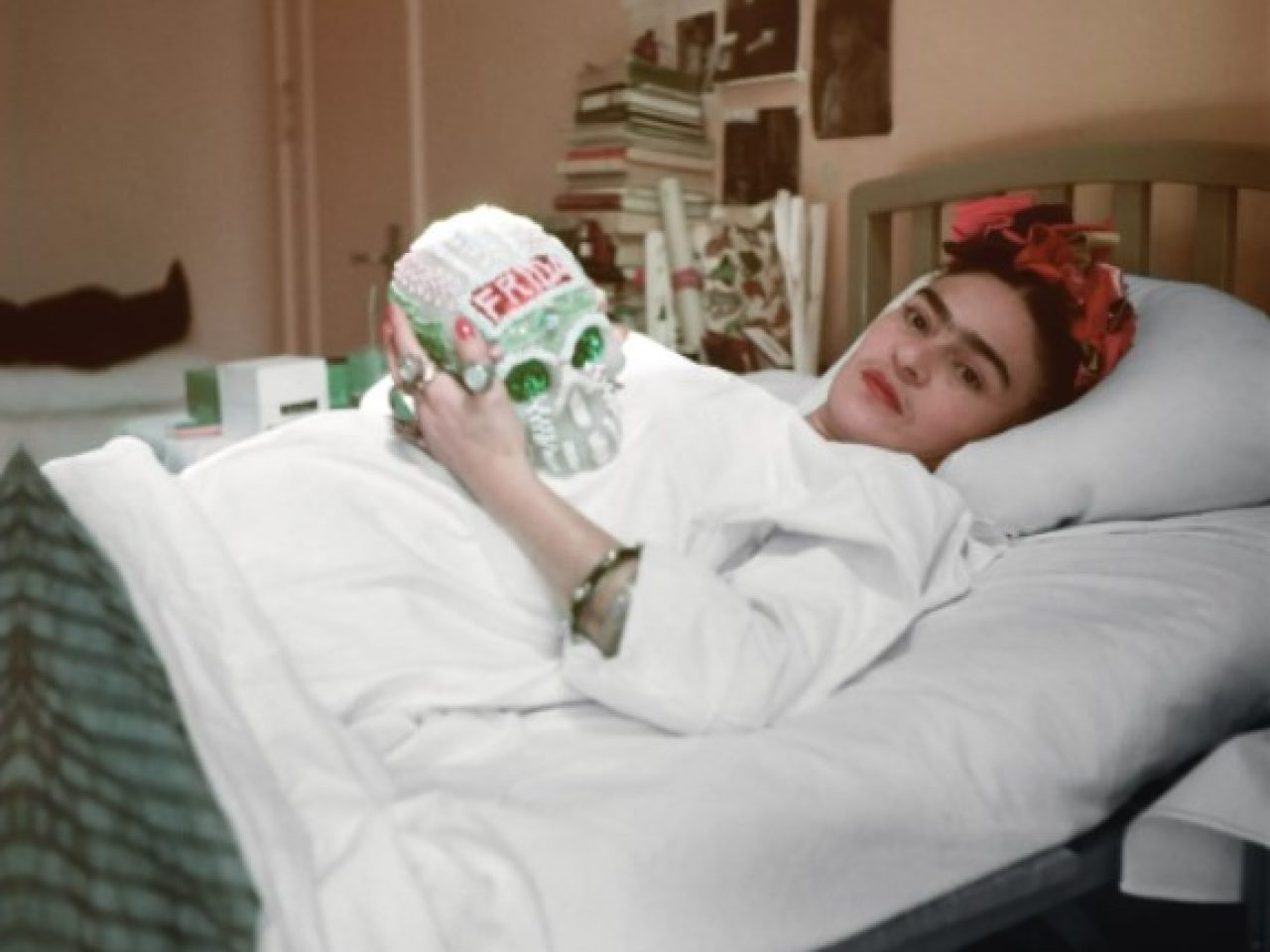 Photo of Frida Kahlo holding a skull