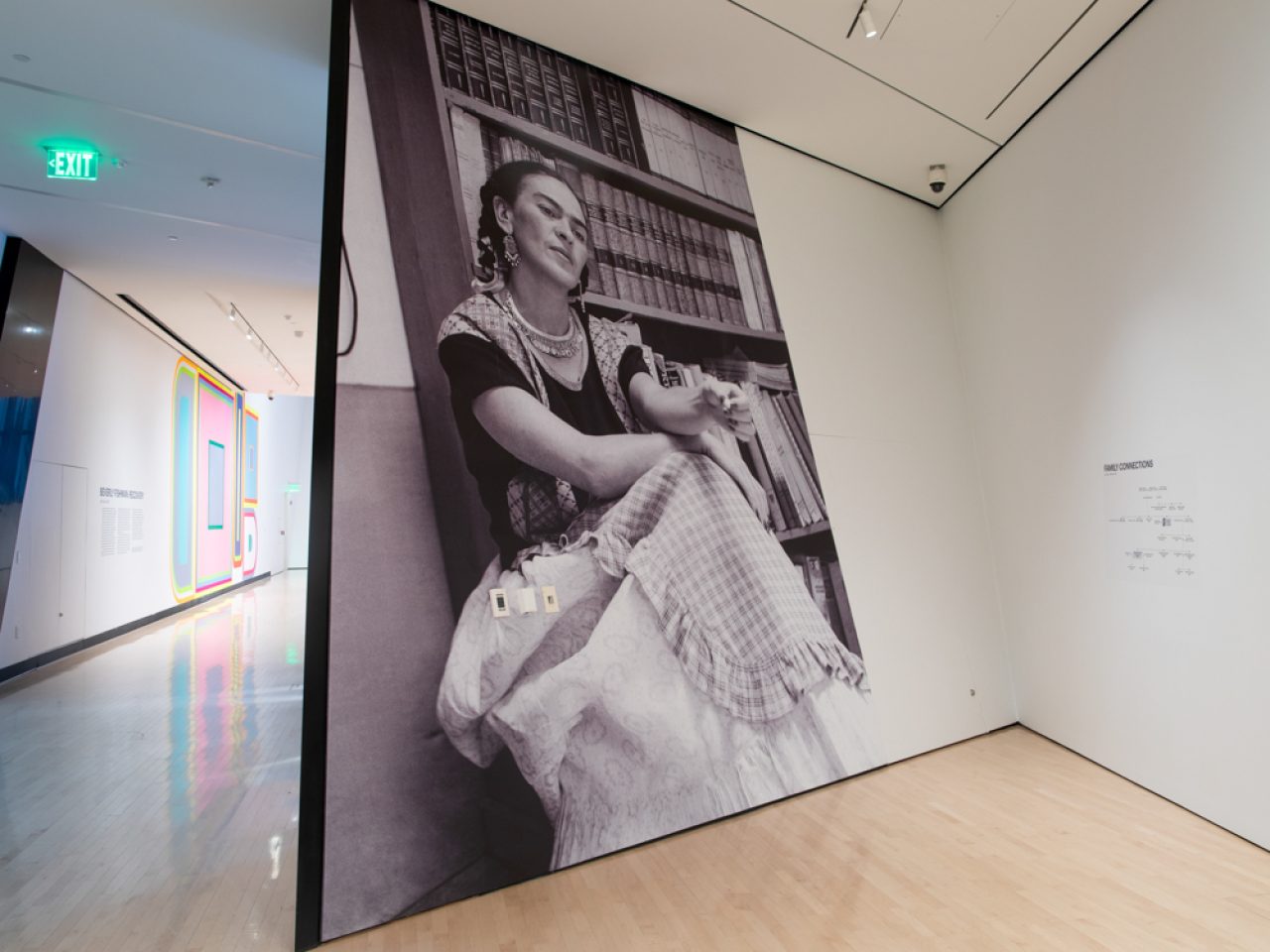 photo of an art gallery showing a large photo of a woman sitting