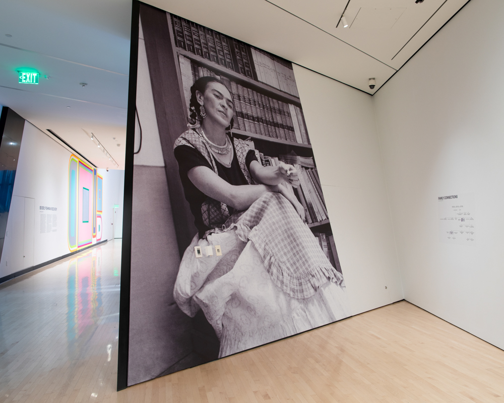 photo of an art gallery showing a large photo of a woman sitting