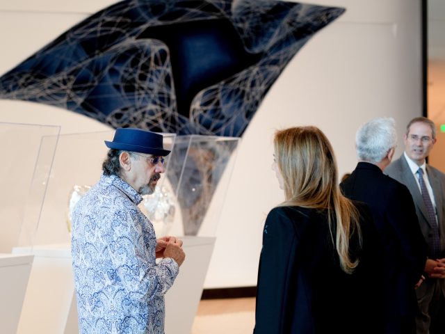 Visitors at the MSU Broad Art Museum talk about the Zaha Hadid Design: Untold exhibition together.