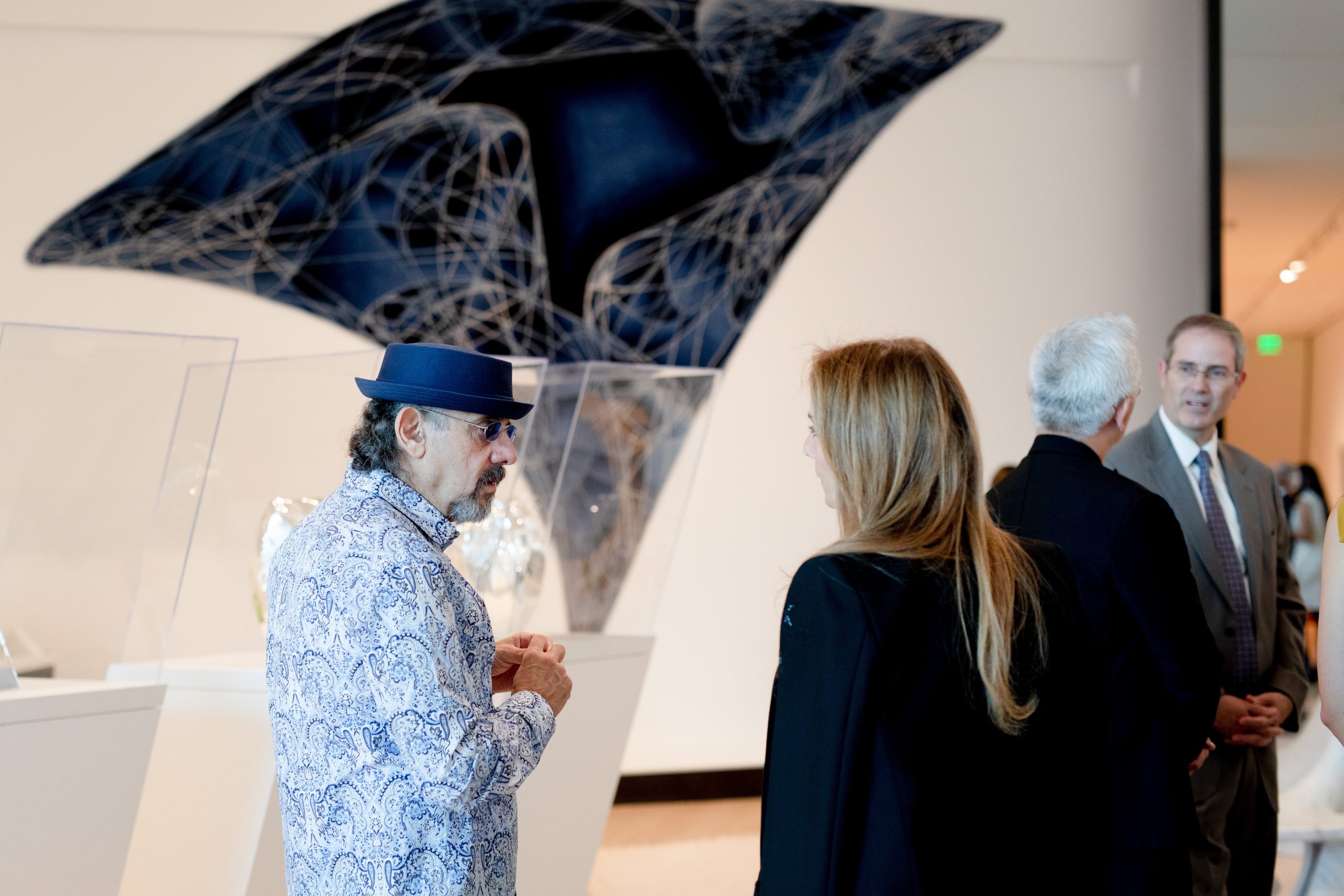 Visitors at the MSU Broad Art Museum talk about the Zaha Hadid Design: Untold exhibition together.
