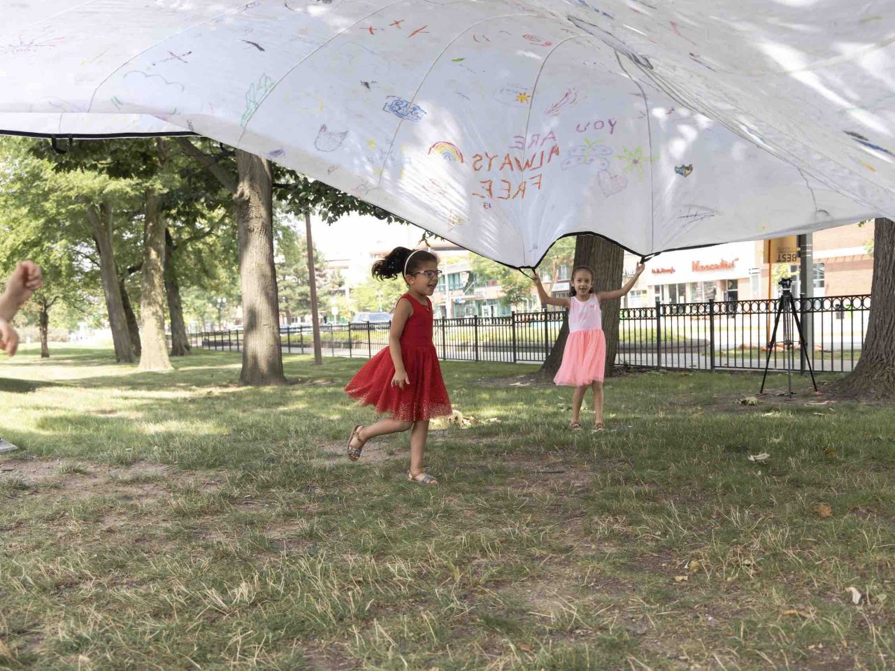 Kids playing under parachute