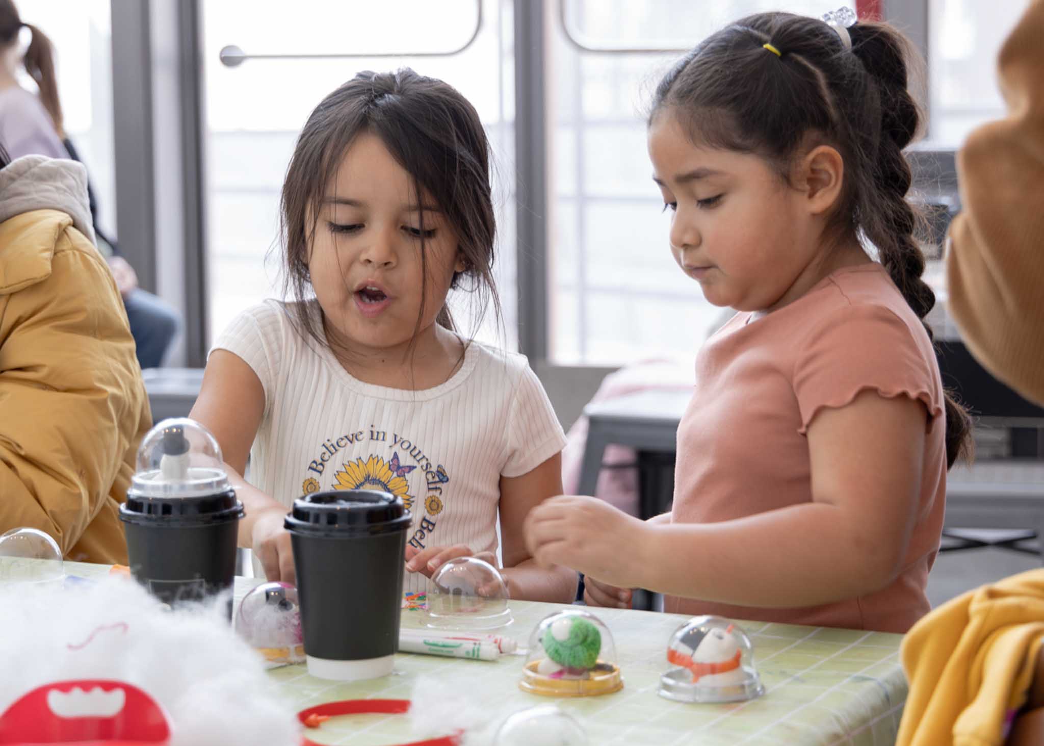 Two children making crafts