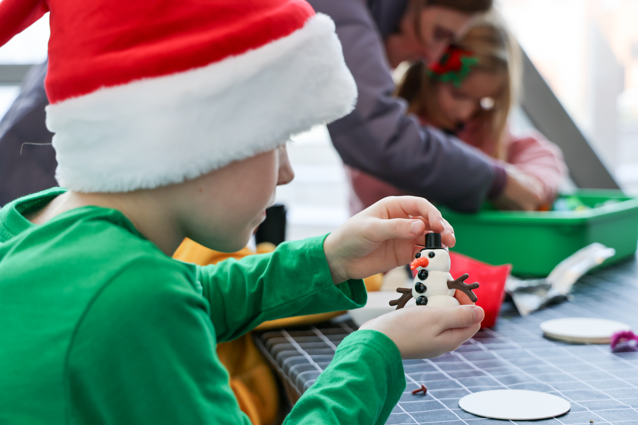 child making a clay snowman